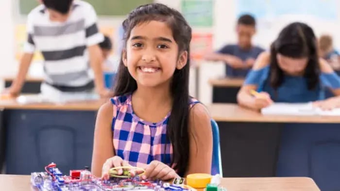 Indian kid doing science project