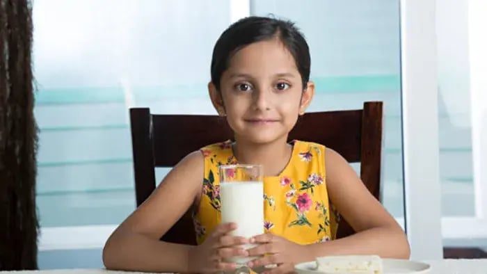 Indian kid drinking milk