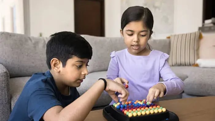 Indian Kid Playing Puzzle