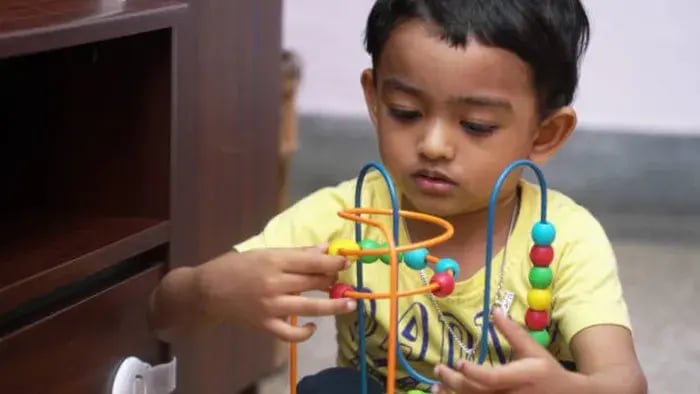 Indian Kid Playing Puzzle
