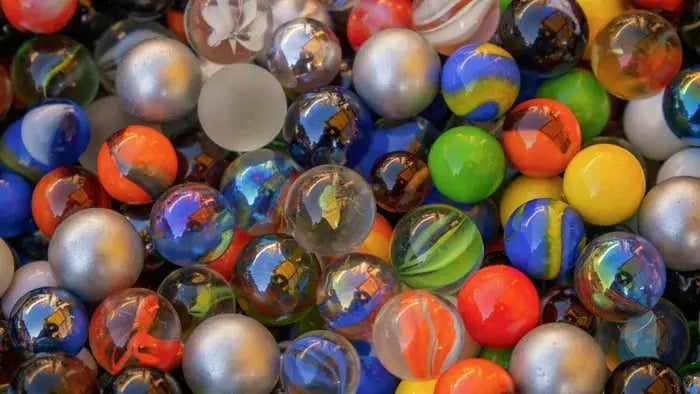 Fun and Challenging Marble Games for Kids: Play and Learn Together - Marble Sensory Bin
