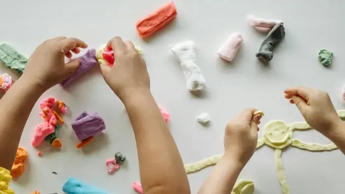 Fun and Educational Activities for Kids to Learn and Play at Home - Kid playing with different types play dough