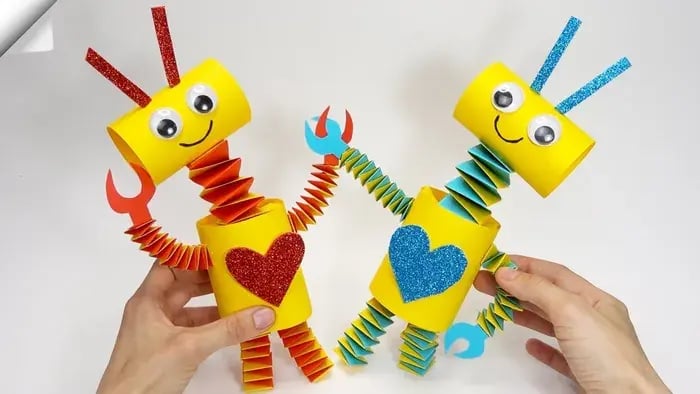 Two cardboard robots