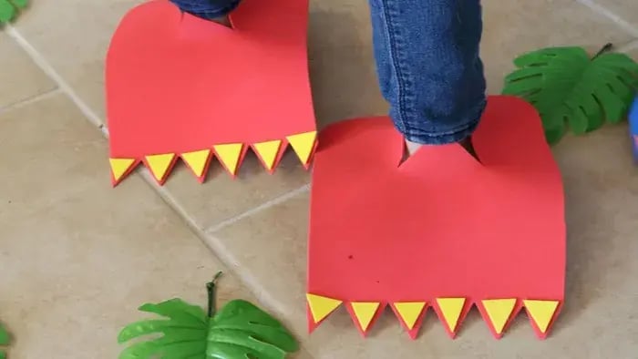 Red dinosaur feet with nails