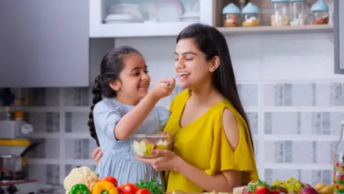 Indian kids cooking with parents
