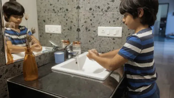 Indian kid washing hands