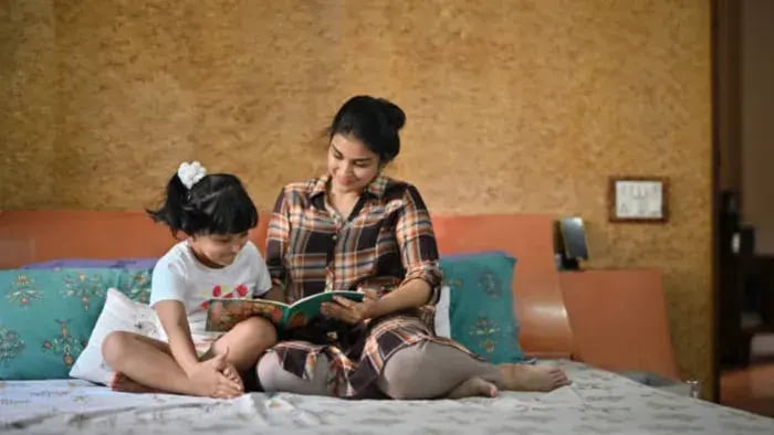 Indian kids reading with parents