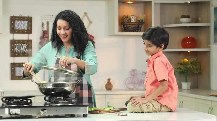 Son Learning Culinary Art From Parent