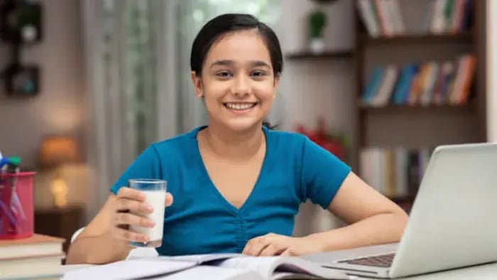 Indian kids drinking milk