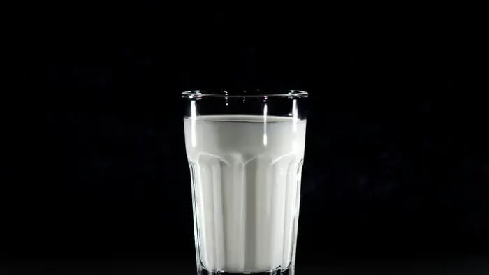glass of milk kept on a table