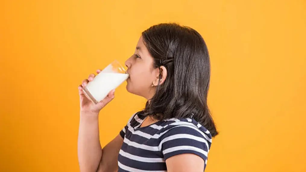 Indian kid drinking milk