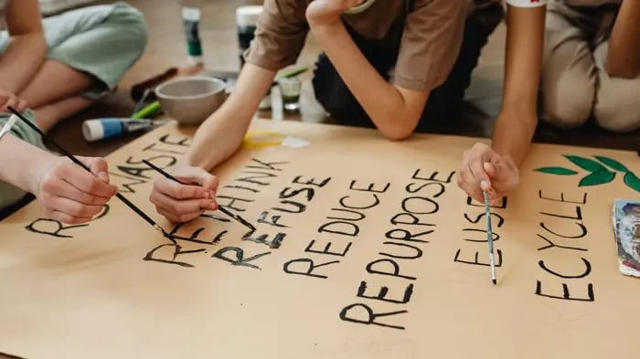 Kids painting with a brush