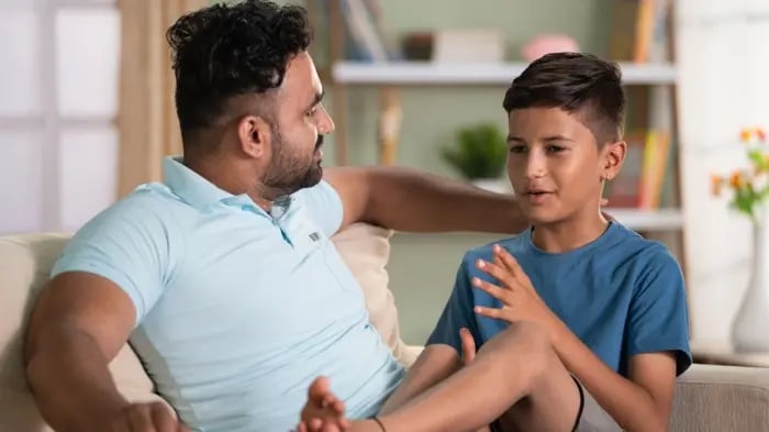 Boy Talking To Father Coping With Emotions As A Life Skill