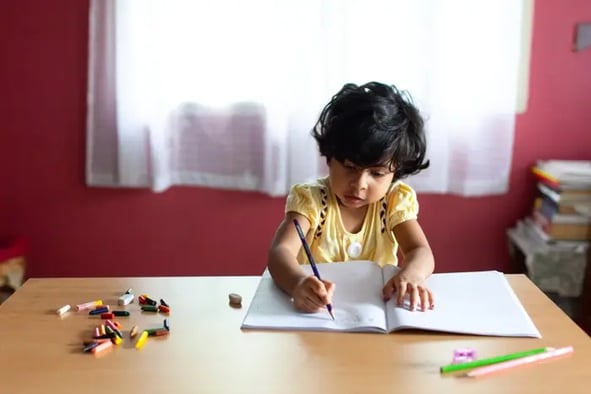 girl writing on a sheet