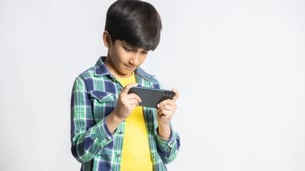 Indian kid using phone