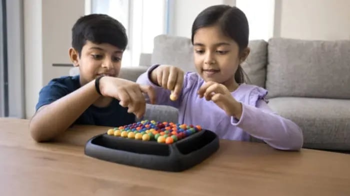 Indian Kid Playing Puzzle