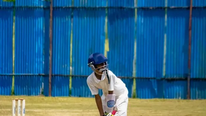 How Sports Help Students: 8 Benefits of Physical Activity - Kid playing cricket