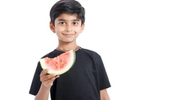 Indian kids eating fruits