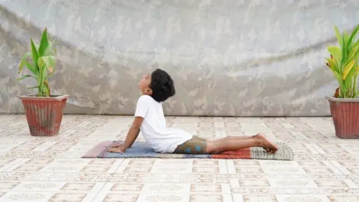 Indian kid doing full body stretching