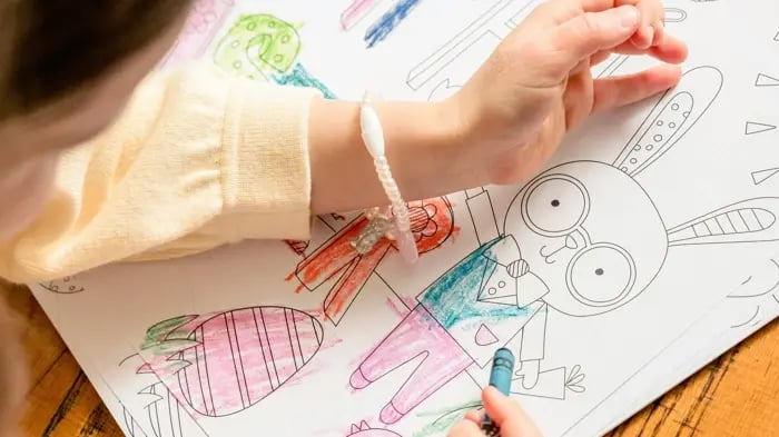 Kid Drawing On A Sheet