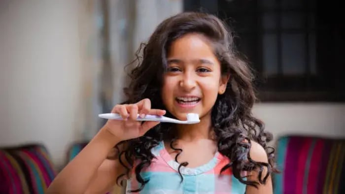 Indian kids brushing teeth