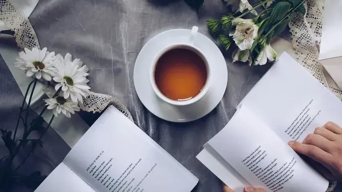 book on a table with herbal tea