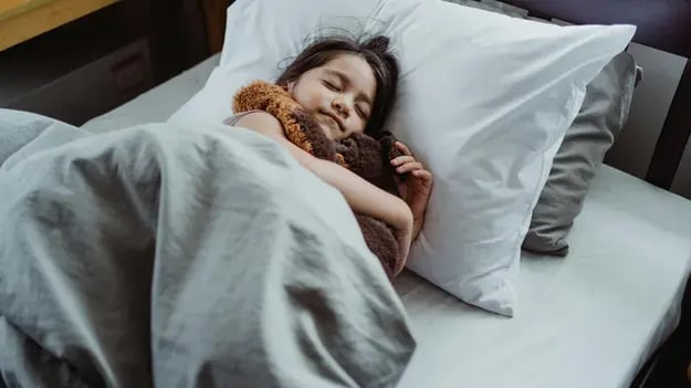 Kids Sleeping On A Bed