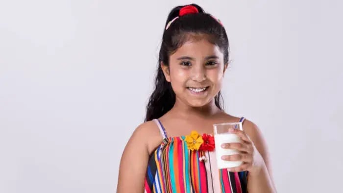 Indian kids drinking milk