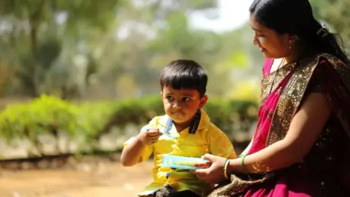Indian Kid And Parents Eating