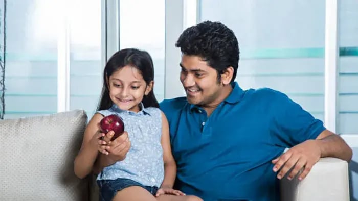 Indian Kid And Parents Eating