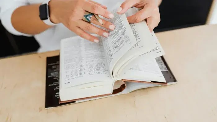 Kid reading a dictionary