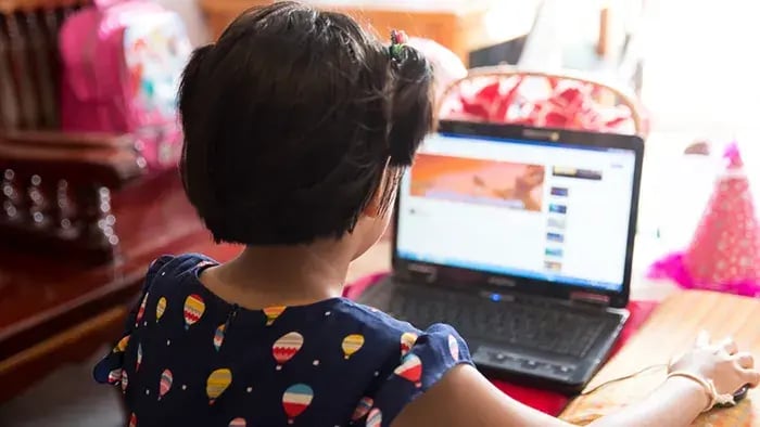 girl studying from a laptop
