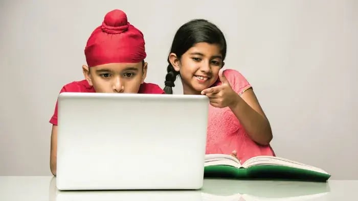 kids looking happy while attending online class