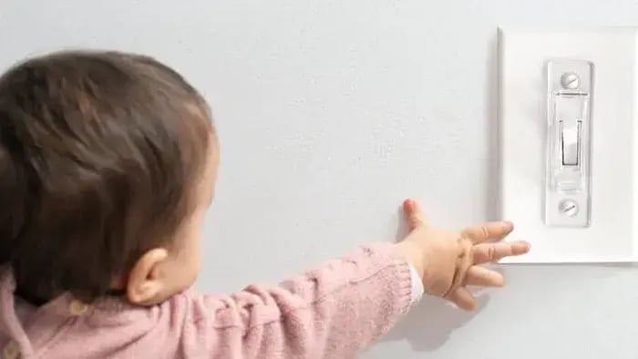 Kid touching an electric board