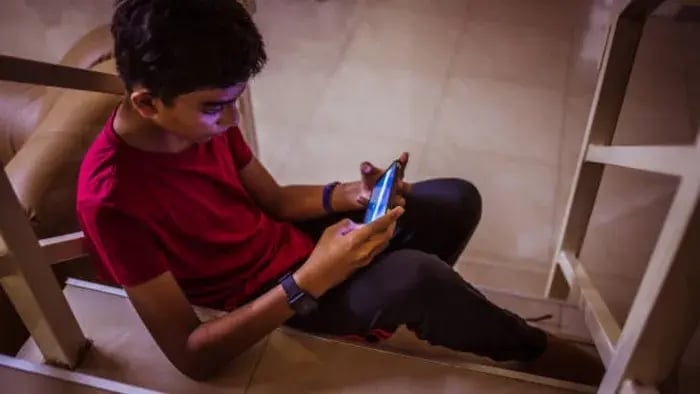 Indian Kid using Phone
