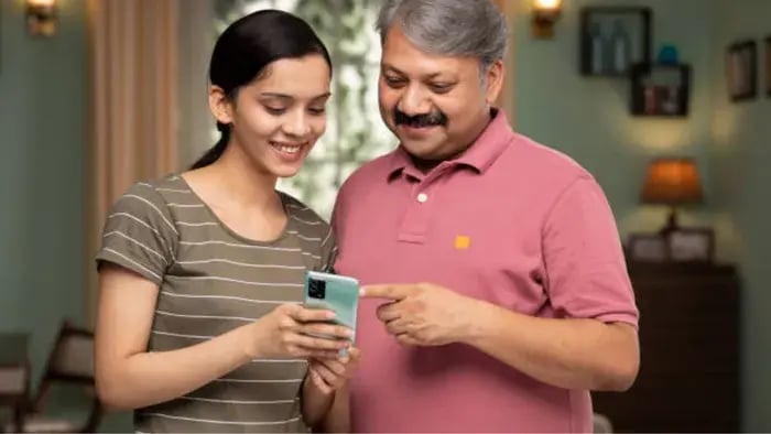 Indian Kid and Parent using Phone