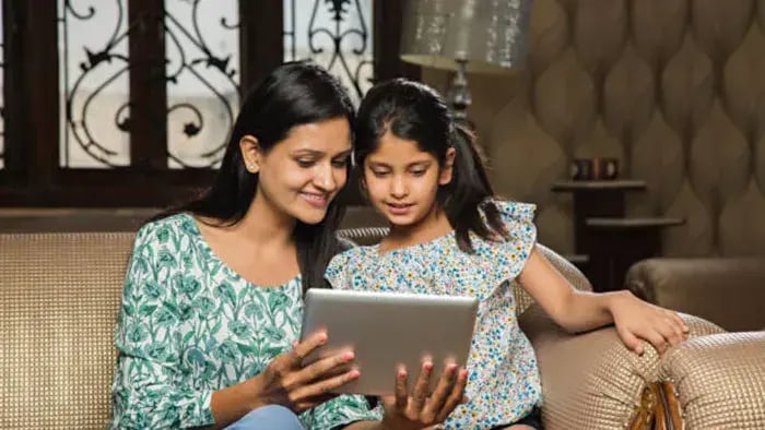 Indian kid studying with mom