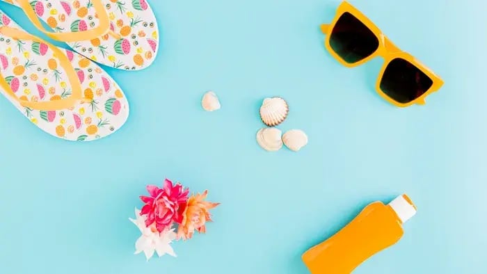 summer essentials-sunscreen, slippers, amd sunglasses etc