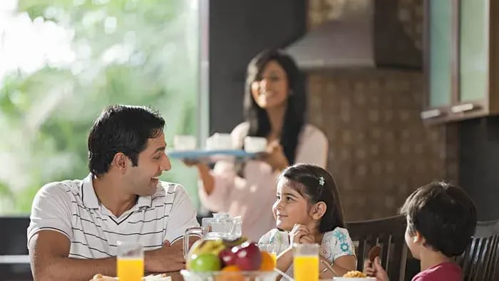 Indian kids and parents eating