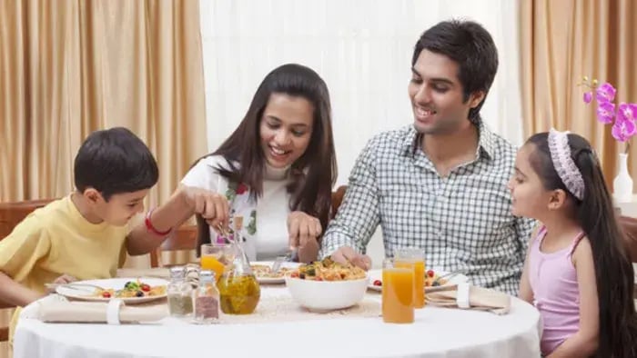 Indian kids and parents eating