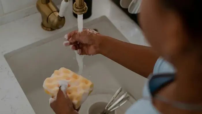 kid doing dishes
