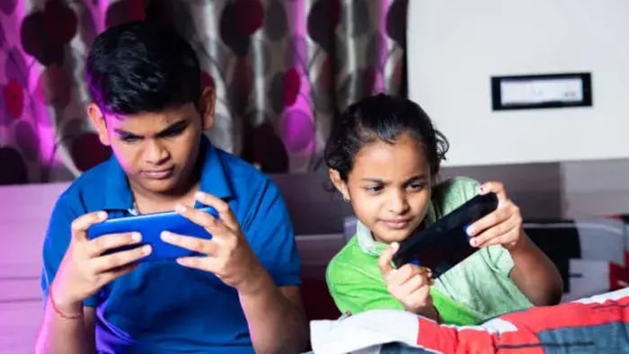 Indian kids using phone
