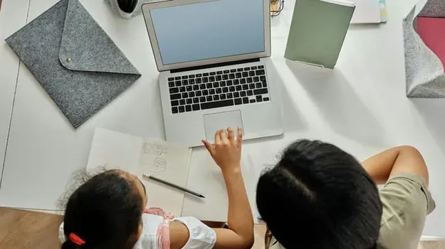 Mother And Daughter Studying