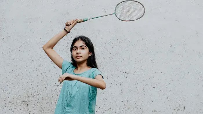 girl playing badminton