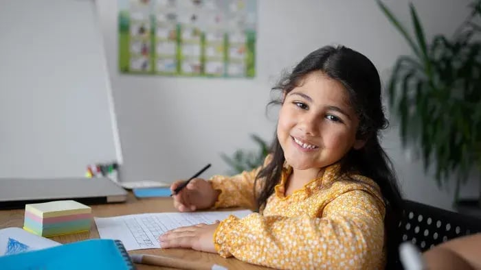 girl smiling while studying