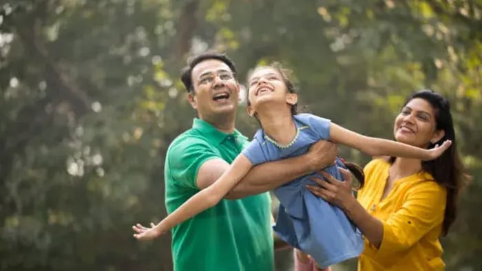 Indian kids outside with parents