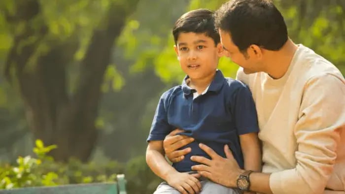 Indian kids outside with parents