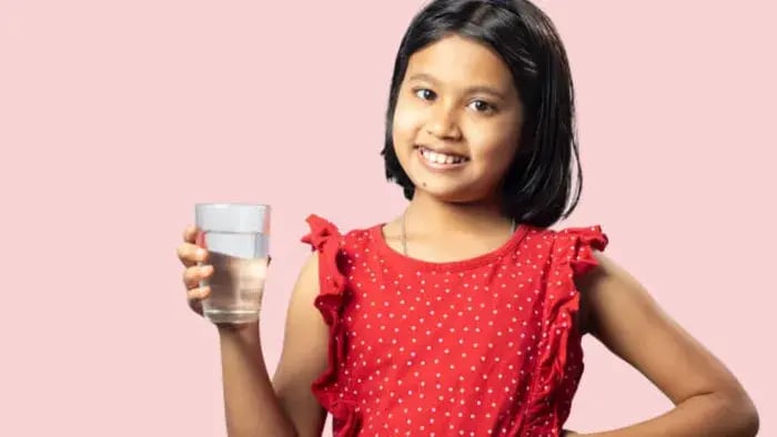 Indian Kid Drinking Water