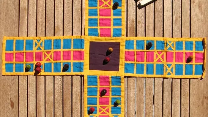 Pachisi board with game pieces
