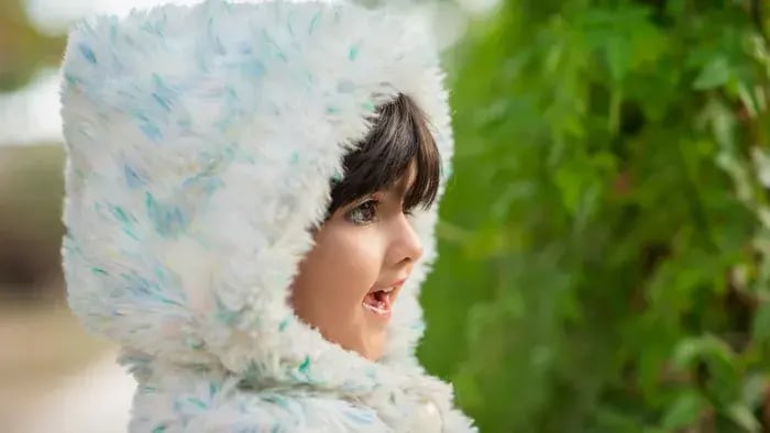 Kid Smiling Wearing A Sweater